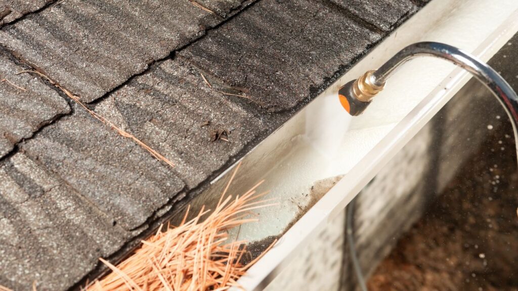 how to clean gutters with a pressure washer
