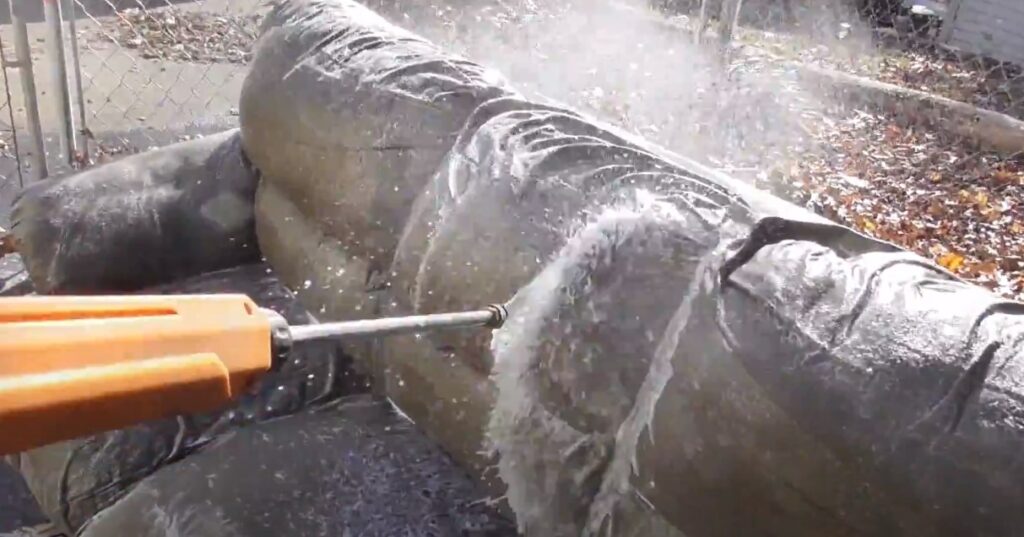 washing the couch with pressure washer